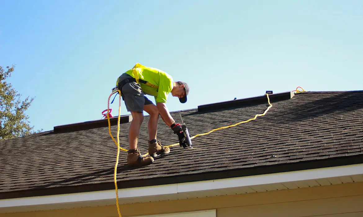 Man fixing roof